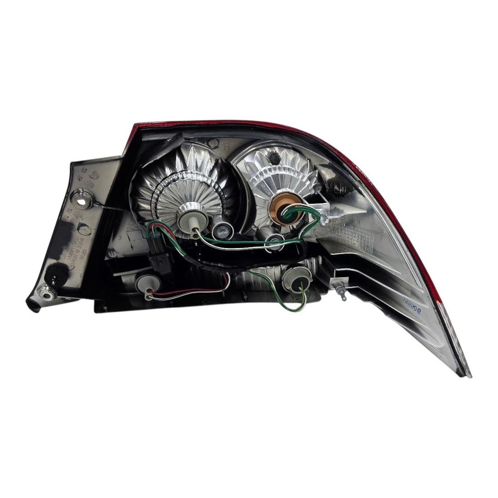 STOP IZQ. ROJO LANCER TOURING 05-15
